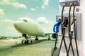 Electric aircraft charger station with plug and power cable supply on cargo or airplane parking with blue sky background