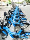 Electric bikes for rent parked on a street of Madrid