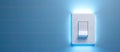 Electric blue light switch on blue wall, creating symmetry in rectangle shape Royalty Free Stock Photo