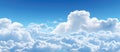 Electric blue sky dotted with fluffy white cumulus clouds Royalty Free Stock Photo