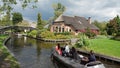 Electric boat at canal in romantic water village Giethoorn in the Netherlands Royalty Free Stock Photo