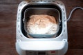 Electric bread maker with ingredients for baking bread. Fresh homemade bread Royalty Free Stock Photo