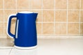 An electric bright kettle heats water in the kitchen