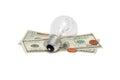 Electric bulb on dollar bills with cents