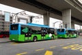 Electric bus at a stop is charged by pantograph. Clean mobility