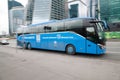Electric bus on the street of Moscow. City-Shuttle blue bus on the street near Moscow International Business Center