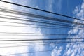 Electric cable with blue sky white clouds Royalty Free Stock Photo