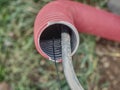 Electric cable in the flexible safety pipe in pit Royalty Free Stock Photo