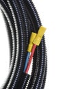 Electric cables with terminals in protective corrugated pipe Royalty Free Stock Photo