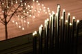 Electric candles by the clear glass window during Christmas season Royalty Free Stock Photo