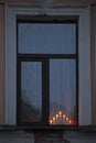 Electric candlestick on the window