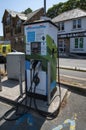 Electric car battery charger for public use in a UK car park. Royalty Free Stock Photo