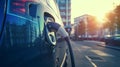 An electric car being charged on a city street