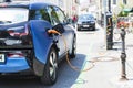 Electric car BMW I3 charging its batteries on a charging station Royalty Free Stock Photo