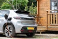 Electric car on charge at home using charging using a granny cable