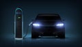 Electric car charge. Realistic automobile charging battery at station. Auto with glowing headlights recharges Royalty Free Stock Photo