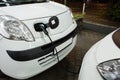 Electric car charged on a charging station in a indoor parking Royalty Free Stock Photo