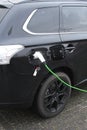 Modern electric plug car charges new electric energy, Netherlands Royalty Free Stock Photo