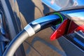 Electric Car Charging Connector Attached to Vehicle Royalty Free Stock Photo