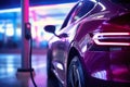 Electric car charging on parking lot with electric car charging station on city street. Electric cars in the row ready for charge Royalty Free Stock Photo