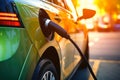 Electric car charging on parking lot with electric car charging station on city street. Electric cars in the row ready for charge Royalty Free Stock Photo