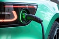 Electric car charging station close-up. Green electric car close up. Generative AI Royalty Free Stock Photo