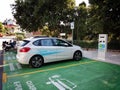 Electric car charging at a charging station