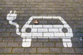 The electric car in the charging station pictogram icon is drawn on the road tile