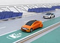 Electric car driving on the wireless charging lane of the highway