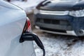 Electric car getting charged in Montreal after snowstorm Royalty Free Stock Photo