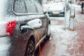 Electric car plug charging in the winter Royalty Free Stock Photo