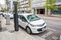 Electric car for sharing being recharged at a sharing location in Los Angeles downtown