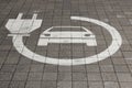 Electric car sign on road. Pictogram at the parking place. Car charging icon