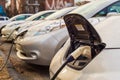 Electric cars charging at recharging station.