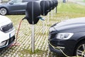 Electric cars in charging station in outdoor parking