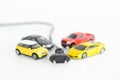 Electric cars concept with many toys vehicles on white background