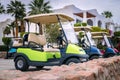 Electric cars for moving around the resort complex of a five-star hotel. A means of transportation for tourists. Several Golf cars Royalty Free Stock Photo