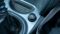 Electric cigarette lighter in an old worn dusty dirty car interior, car inside detail shot, closeup, nobody. Smoking in vehicles Royalty Free Stock Photo