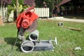 Electric circular saw cutting the cement pipe.