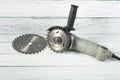 Electric circular saw on wood background. Copy space for text