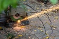 Electric circular steel cutting machine and sparkle.  workers use tools to cut steel for building up and sparks from real-world si Royalty Free Stock Photo