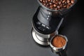 Electric coffee grinder and portafilter Royalty Free Stock Photo