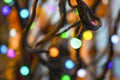 Electric colored garland on decorative tree