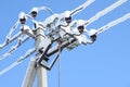 Electric communications wires covered with ice and snow. Snow-covered power cable lines and pole. Power electric transmission line Royalty Free Stock Photo