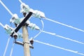 Electric communications wires covered with ice and snow. Snow-covered power cable lines and pole. Power electric transmission line Royalty Free Stock Photo