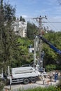 Electric company team working on a transmission tower