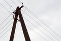 Electric concrete pillar of high voltage power line with wires against