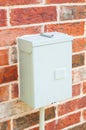 Electric control box on red brick wall Royalty Free Stock Photo