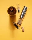 Electric corkscrew made of gray metal. Bottle, aerator, vacuum cork for wine. On a yellow background. Isolated. Hard light and Royalty Free Stock Photo