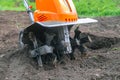 Electric cultivator for cultivating soil in vegetable garden Royalty Free Stock Photo